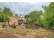 Spacious backyard with a pool, patio, and lush green surroundings at 95 Weslyan Way, Oxford, GA 30054