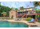 Stunning backyard with a private pool, stone patio, and multi-tiered deck perfect for entertaining at 95 Weslyan Way, Oxford, GA 30054