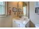 Cozy bathroom featuring a vanity with storage, natural light, and neutral color palette at 95 Weslyan Way, Oxford, GA 30054