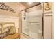 Clean bathroom with a modern shower featuring sliding glass doors and tiled walls at 95 Weslyan Way, Oxford, GA 30054