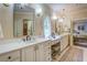 Elegant bathroom with dual sinks, vanity, and marble countertops, providing a spa-like experience at 95 Weslyan Way, Oxford, GA 30054