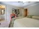 Well-lit bedroom showcasing two twin beds, stylish decor, and adjacent bathroom access at 95 Weslyan Way, Oxford, GA 30054