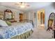 Bright bedroom with a decorative metal bed frame, walk-in closet and ensuite bathroom at 95 Weslyan Way, Oxford, GA 30054