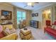 Cozy bedroom with a ceiling fan, comfortable seating, and an ensuite bathroom for added convenience at 95 Weslyan Way, Oxford, GA 30054
