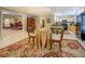Open concept dining area connecting to the kitchen with elegant furnishings and bright natural light at 95 Weslyan Way, Oxford, GA 30054