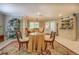 Inviting dining area with elegant furnishings, decorative hutch, and a large decorative rug at 95 Weslyan Way, Oxford, GA 30054