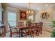 Formal dining room with a large table, chandelier, and elegant decor, perfect for hosting dinner parties at 95 Weslyan Way, Oxford, GA 30054