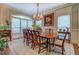 Elegant dining room showcasing a chandelier, large window, and sophisticated decor for memorable gatherings at 95 Weslyan Way, Oxford, GA 30054