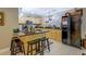 Bright kitchen with stainless steel appliances, granite countertops, and a center island with bar stool seating at 95 Weslyan Way, Oxford, GA 30054