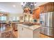 Open kitchen with stainless appliances, granite countertops, and a large center island at 95 Weslyan Way, Oxford, GA 30054