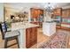 Open kitchen with island, granite countertops, and stainless steel appliances at 95 Weslyan Way, Oxford, GA 30054