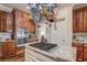 Kitchen island with stainless steel cooktop and granite countertop at 95 Weslyan Way, Oxford, GA 30054