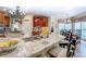 Bright, large kitchen with granite counters, stainless appliances, and island seating at 95 Weslyan Way, Oxford, GA 30054