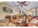 Spacious living area with fireplace, hardwood floors, and an open staircase at 95 Weslyan Way, Oxford, GA 30054