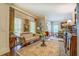 Elegant living room featuring large windows, hardwood floors, and sophisticated decor, creating a welcoming ambiance at 95 Weslyan Way, Oxford, GA 30054