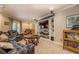 Spacious living room featuring a built-in entertainment center and comfortable leather seating at 95 Weslyan Way, Oxford, GA 30054