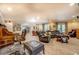 Spacious living room with comfortable leather seating, a bar area, and lots of space to entertain at 95 Weslyan Way, Oxford, GA 30054