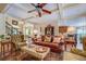 Bright living room with coffered ceilings, hardwood floors, and ample seating at 95 Weslyan Way, Oxford, GA 30054