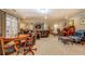 Spacious living room is designed for entertainment with large windows and lots of leather seating at 95 Weslyan Way, Oxford, GA 30054