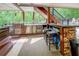 Well-equipped outdoor kitchen with stainless steel appliances and bar seating at 95 Weslyan Way, Oxford, GA 30054