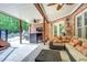 Outdoor living space featuring brick, ceiling fans, and an outdoor television at 95 Weslyan Way, Oxford, GA 30054