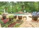 Beautiful pool area with waterfalls, ample seating, and lush landscaping at 95 Weslyan Way, Oxford, GA 30054
