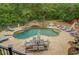 Backyard pool featuring palm trees and waterfalls at 95 Weslyan Way, Oxford, GA 30054