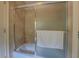 Bathroom featuring a shower-tub combination with textured sliding glass doors at 95 Weslyan Way, Oxford, GA 30054