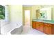 This bathroom features a tub with a view and a vanity at 21 Wisteria Run, Hiram, GA 30141
