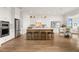 Spacious kitchen with stainless steel appliances, a large island, and adjacent dining area at 219 Laurel Vista Drive Dr, Canton, GA 30114