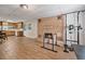 Basement featuring brick fireplace and hardwood flooring at 1777 E Gate Trl, Stone Mountain, GA 30087