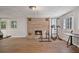 Basement featuring brick fireplace and hardwood flooring at 1777 E Gate Trl, Stone Mountain, GA 30087