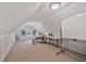 Bonus room with sloped ceilings, carpeted floors and good natural light at 1777 E Gate Trl, Stone Mountain, GA 30087