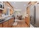 Open kitchen design with stainless steel appliances, granite countertops and a view into the dining area at 1777 E Gate Trl, Stone Mountain, GA 30087