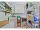 Spacious laundry room offering plenty of storage space with shelving and cabinets, plus a washer and dryer at 1777 E Gate Trl, Stone Mountain, GA 30087