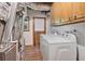 Laundry room includes a washer, dryer, and cabinet storage space at 1777 E Gate Trl, Stone Mountain, GA 30087