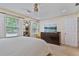 Bright and spacious main bedroom with large windows, neutral walls, ceiling fan and dark wood furniture at 1777 E Gate Trl, Stone Mountain, GA 30087