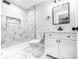 Modern bathroom with marble tile shower, vanity, and mirror at 3978 Oglesby Rd, Powder Springs, GA 30127