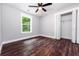 Bedroom with hardwood floors, a ceiling fan and a closet at 3978 Oglesby Rd, Powder Springs, GA 30127