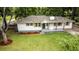 Beautiful single-story home with manicured lawn, freshly painted exterior, and inviting front porch at 3978 Oglesby Rd, Powder Springs, GA 30127