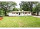 Charming home featuring fresh paint, new shutters and a well maintained lawn at 3978 Oglesby Rd, Powder Springs, GA 30127