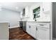Modern kitchen with white cabinets, dark hardware, stainless steel appliances, and stylish countertops at 3978 Oglesby Rd, Powder Springs, GA 30127