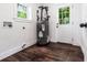 Laundry room with hardwood floors and a water heater at 3978 Oglesby Rd, Powder Springs, GA 30127