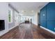 Spacious living area featuring modern decor, dark wood floors, and great lighting at 3978 Oglesby Rd, Powder Springs, GA 30127