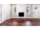 Bright living room featuring a fireplace and dark wood flooring at 3978 Oglesby Rd, Powder Springs, GA 30127