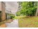 Large, private backyard with mature trees, offering a serene outdoor space at 4248 Wellington Hills Ln, Snellville, GA 30039
