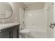 Bathroom with shower and vanity with granite countertop at 4248 Wellington Hills Ln, Snellville, GA 30039