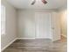 Bedroom featuring light wood look floors and double closet at 4248 Wellington Hills Ln, Snellville, GA 30039