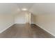 Bedroom with wood floors and a sloped ceiling at 4248 Wellington Hills Ln, Snellville, GA 30039