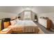 Bedroom featuring a sloped ceiling and gray wood floors at 4248 Wellington Hills Ln, Snellville, GA 30039